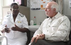 Dr. Lowell Schnipper talking with Mrs. Angeline Bowman, a Registered General Nurse and Midwife, and manager of St. Albert's Cervical Cancer Prevention Program.