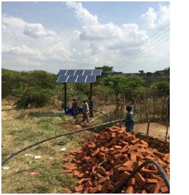 A photo taken during the i nstallation of the solar-powered water pump at St. Albert's Mission Hospital.